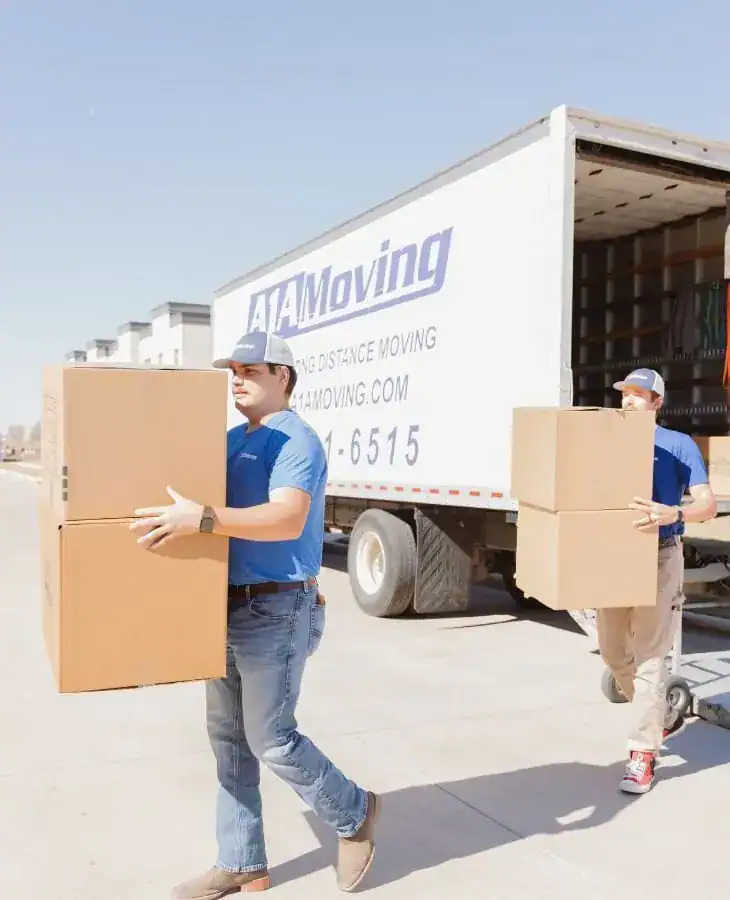 A1A movers carrying boxes away from the moving truck