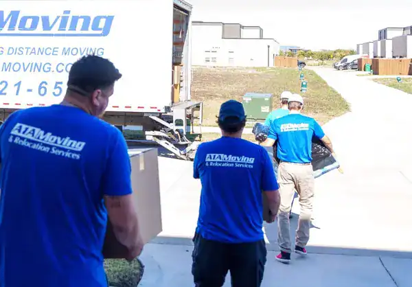 A1A movers carrying boxes from the truck to a home