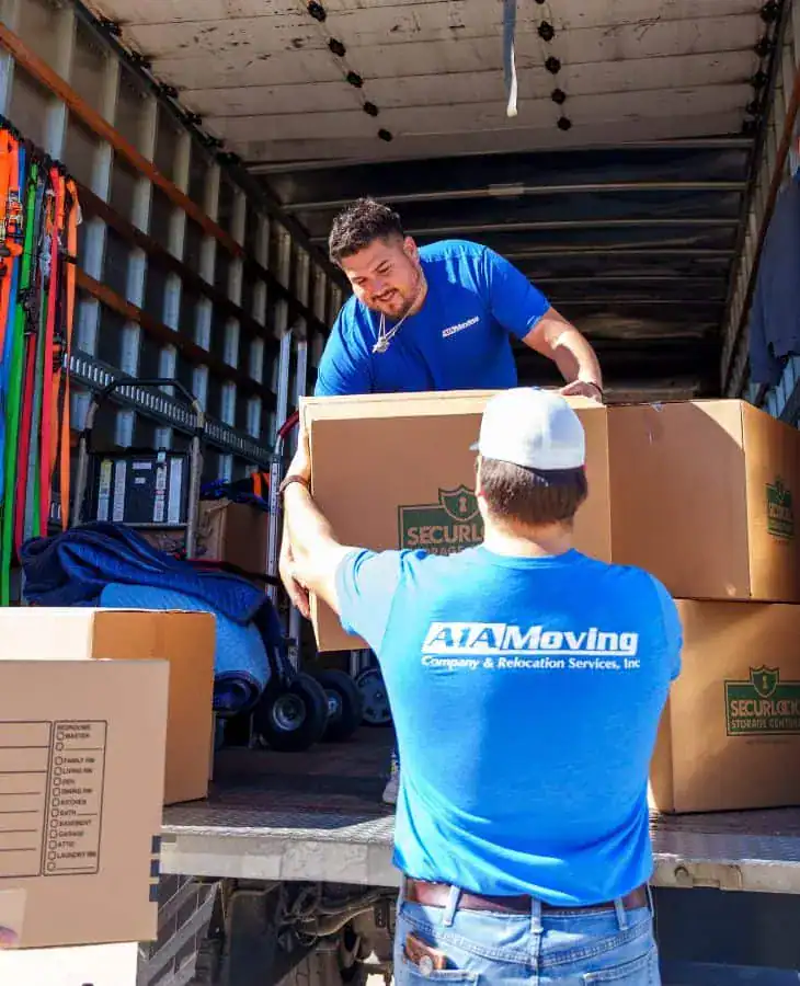 A1A movers stacking boxes inside the moving truck