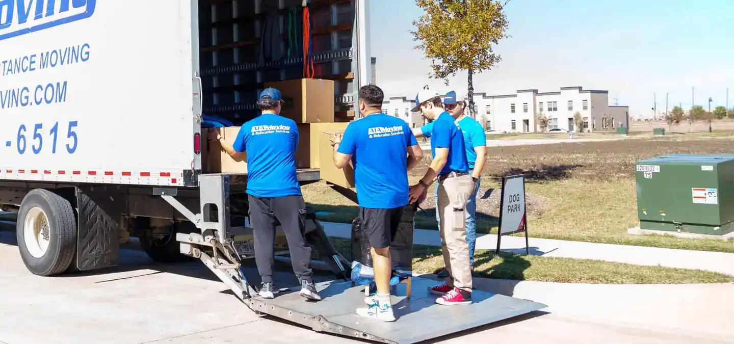 A1A movers unloading boxes on the moving truck lift gate