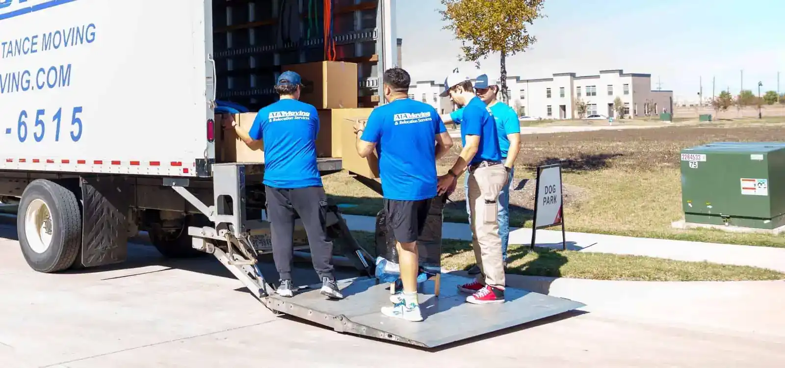 A1A movers unloading boxes on the moving truck lift gate