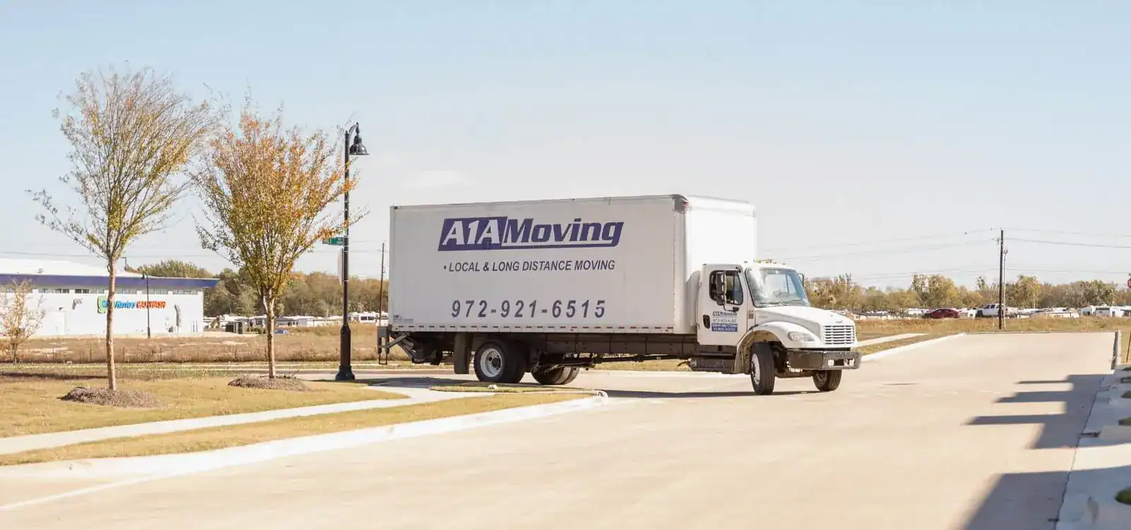 A1A Moving box truck driving on a road