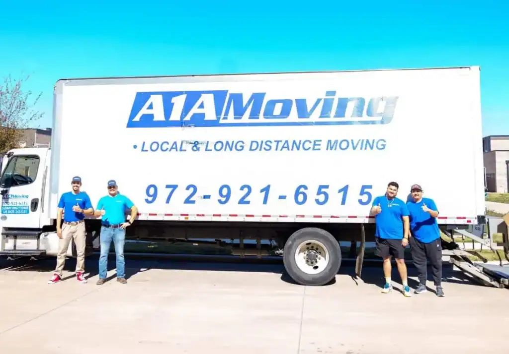 A1A Moving crew standing in front of the A1A moving truck