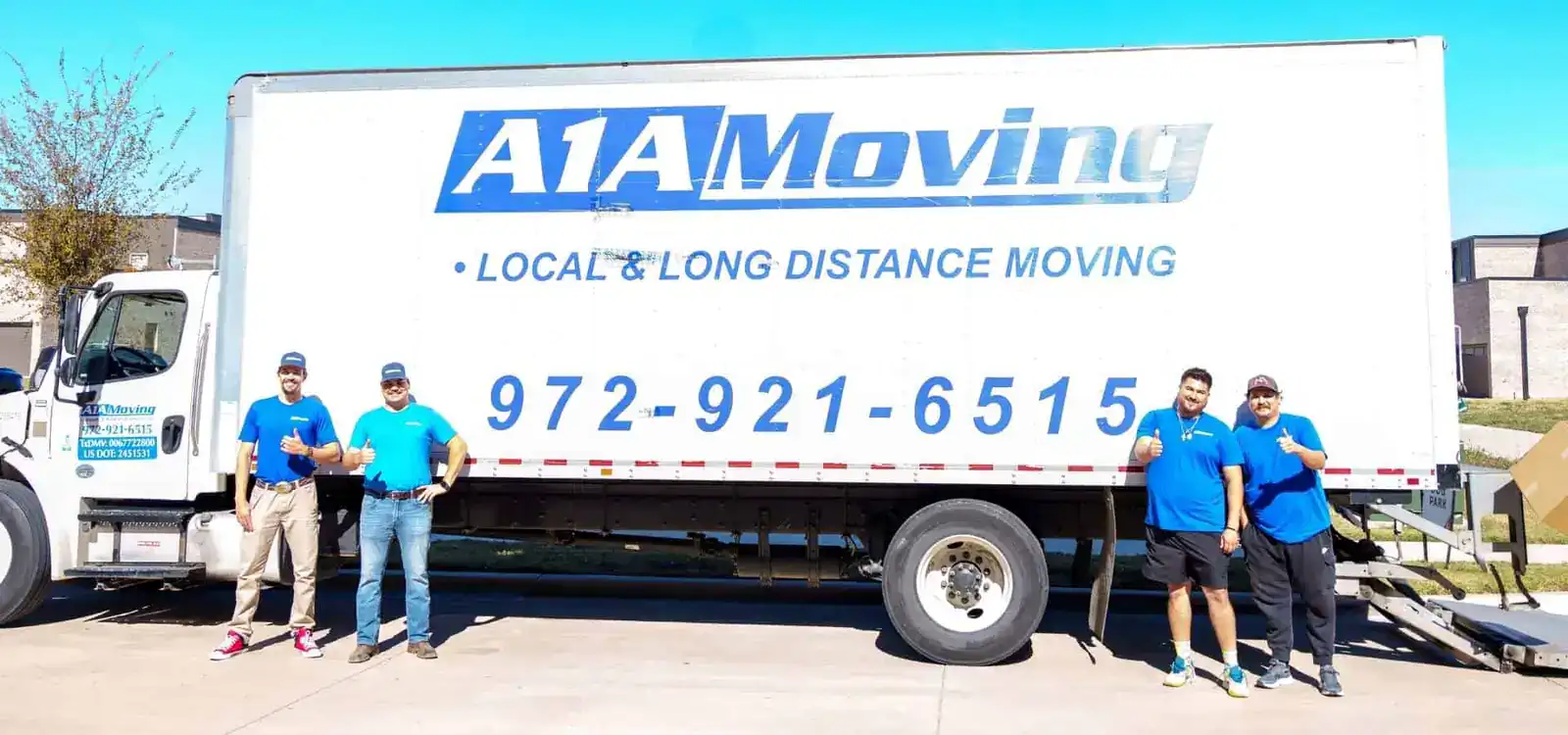 A1A Moving crew standing in front of the moving truck