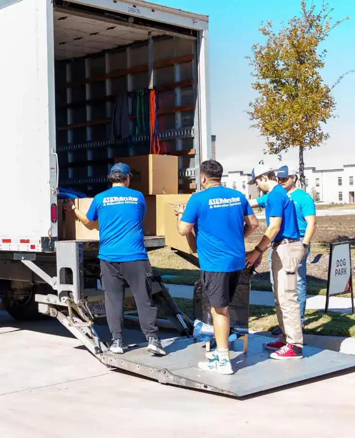 A1A moving crew working at the back of the truck