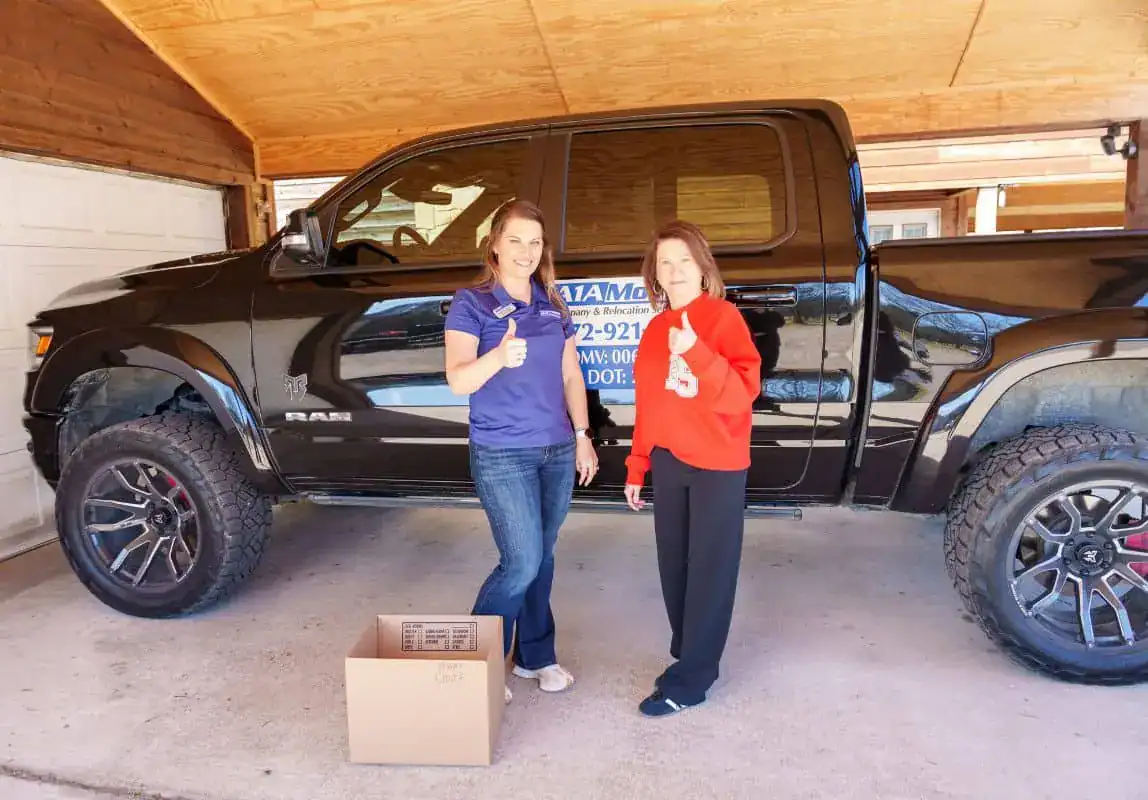 A1A team member and a customer celebrating a finished move