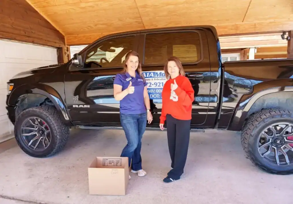 A1A team member and a customer giving a thumbs up after a move